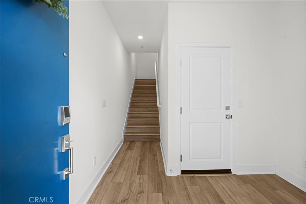 1713 Jade Road Rancho Mission Viejo, CA 92694 - Photo 6 of 53 a view of a hallway with wooden floor