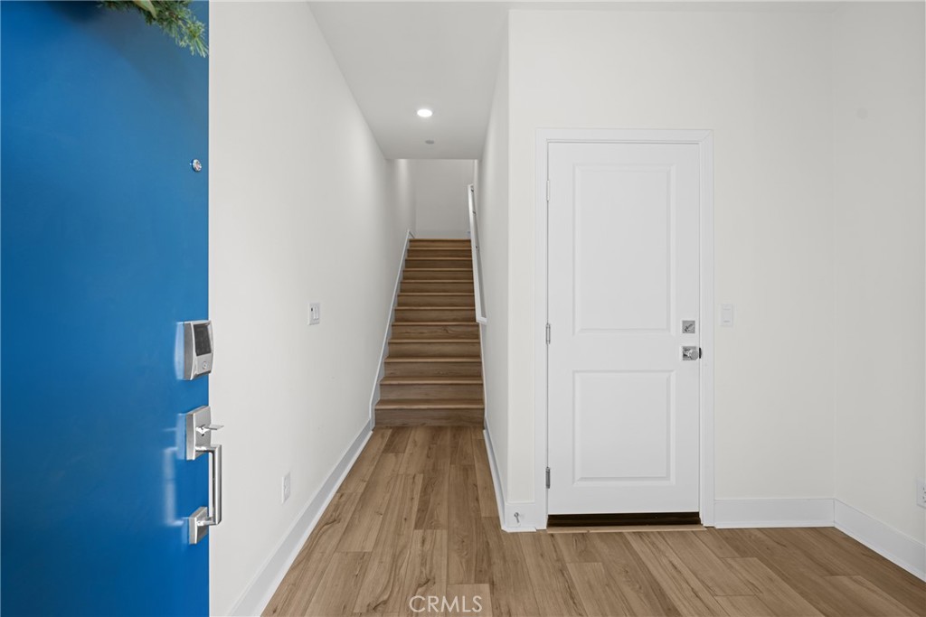 1713 Jade Road Rancho Mission Viejo, CA 92694 - Photo 7 of 53 a view of a hallway with wooden floor
