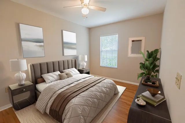 a bedroom with bed window and couch