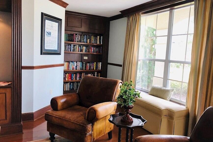 168 Southwest Peacock Boulevard, Unit 35103 Port St. Lucie, FL 34986 - Photo 30 of 43 a living room with furniture and a potted plant