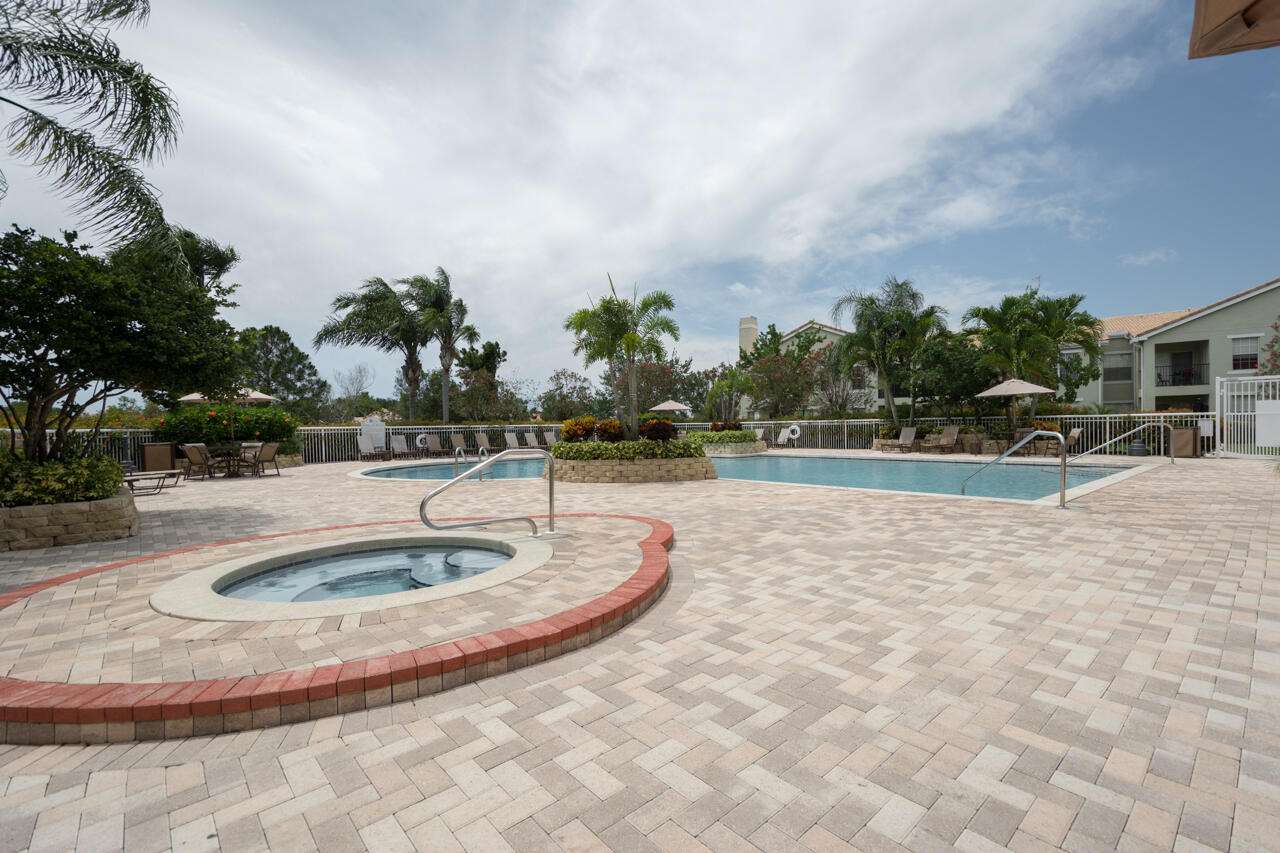 168 Southwest Peacock Boulevard, Unit 35103 Port St. Lucie, FL 34986 - Photo 39 of 43 a view of outdoor space yard and lake