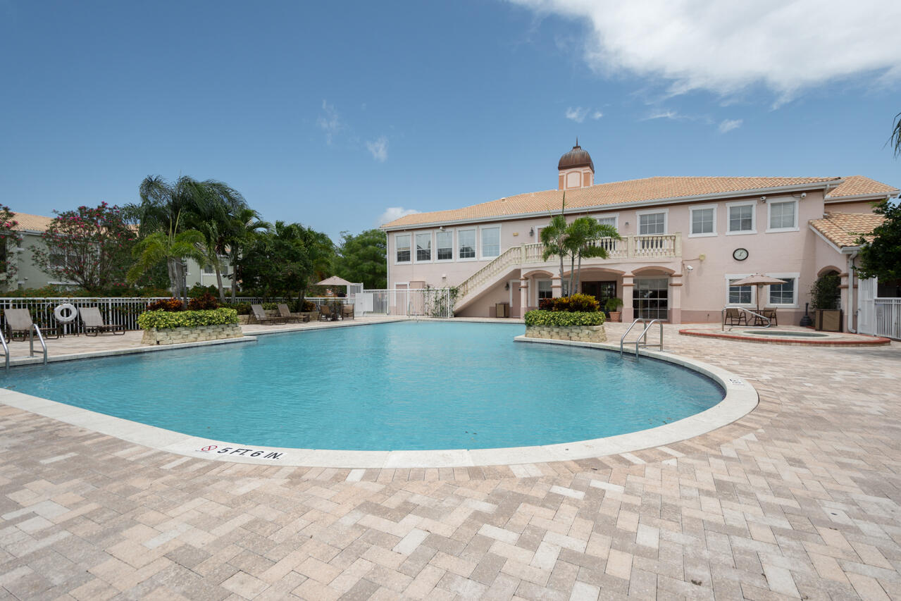 168 Southwest Peacock Boulevard, Unit 35103 Port St. Lucie, FL 34986 - Photo 40 of 43 a view of outdoor space and swimming pool
