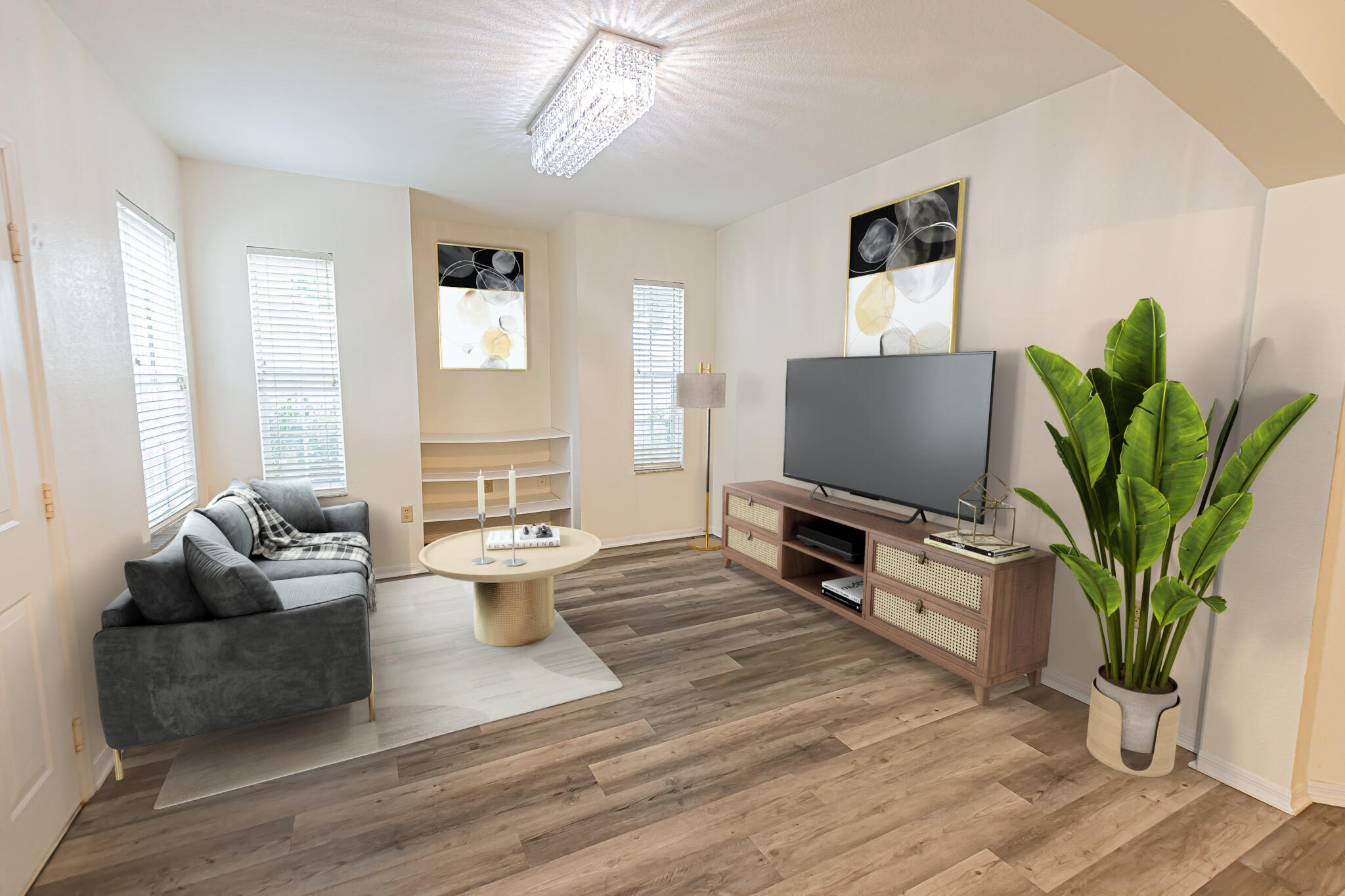 168 Southwest Peacock Boulevard, Unit 35103 Port St. Lucie, FL 34986 - Photo 5 of 43 a living room with furniture and a flat screen tv