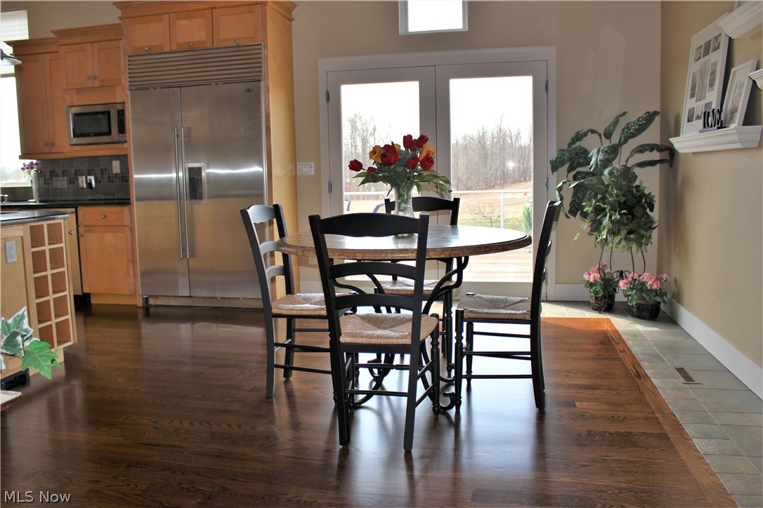 13720 Hale Road Burton, OH 44021 - Photo 7 of 35 EatinKitchen with gleaming hardwood floor, just refinished this month of March.
