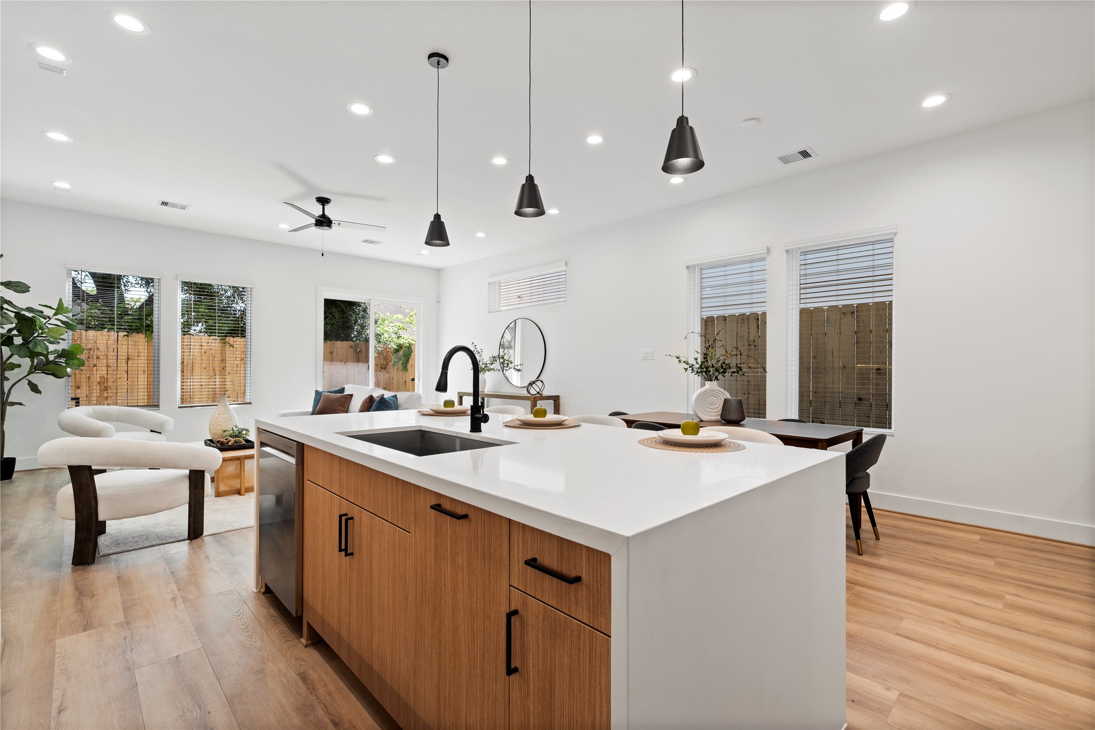 2706 Fox Street Houston, TX 77003 - Photo 12 of 39 a kitchen with stainless steel appliances granite countertop a sink a stove and a wooden floor