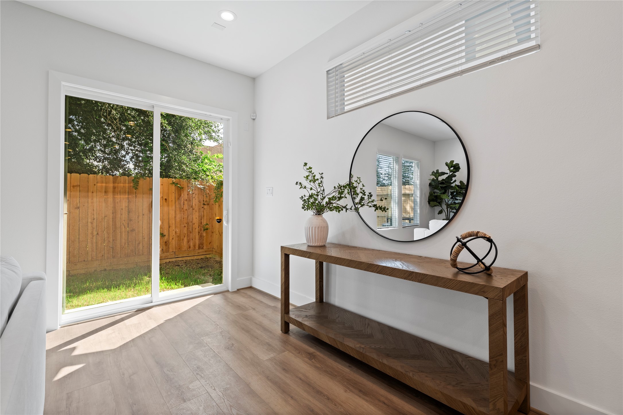 2706 Fox Street Houston, TX 77003 - Photo 16 of 39 a view of house with wooden floor and a window
