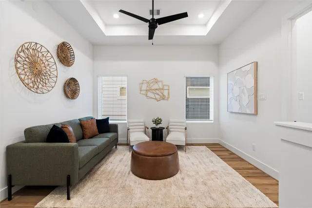 a bedroom with a bed and a flat tv screen on dresser