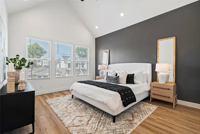 a bathroom with a sink and mirror with bathtub