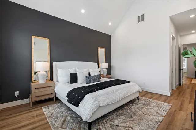 a bathroom with a double vanity sink mirror and shower