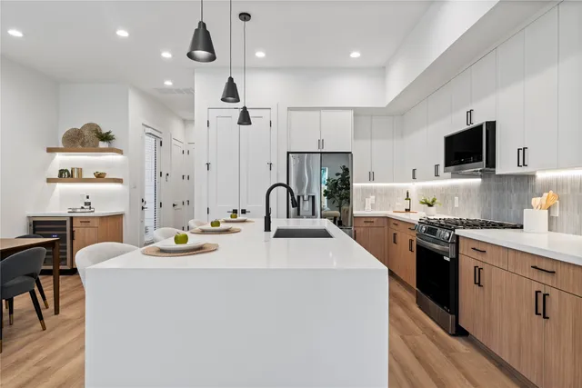 a view of a dining room with furniture and wooden floor