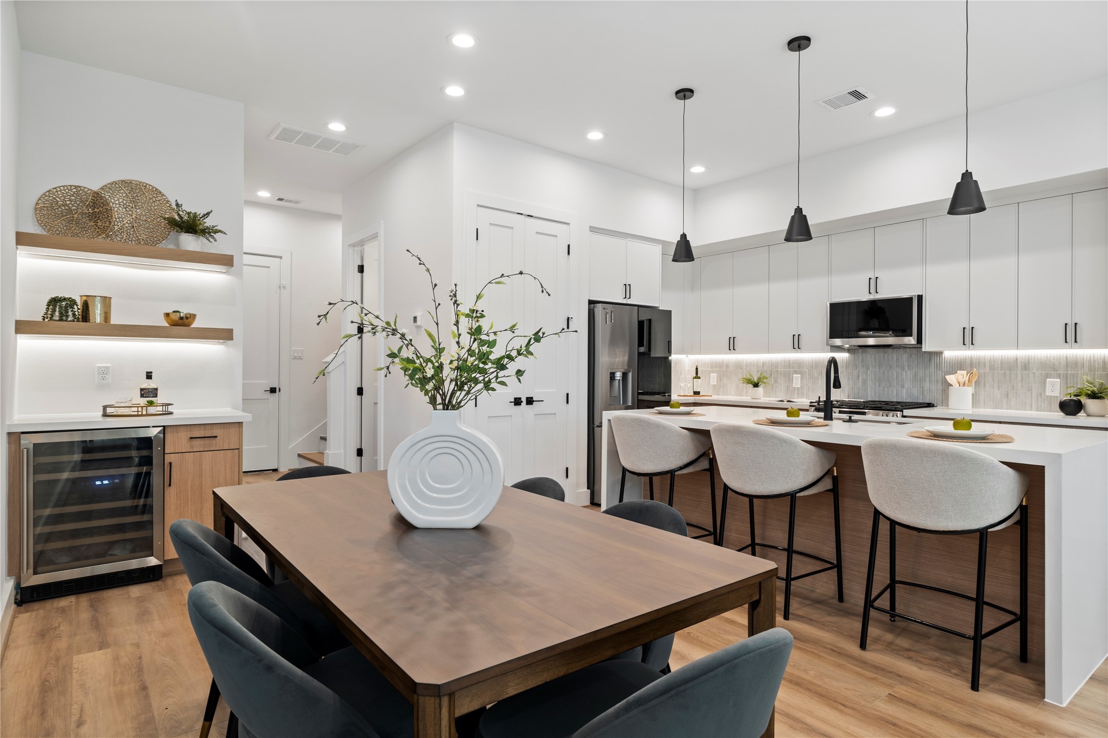 2706 Fox Street Houston, TX 77003 - Photo 8 of 39 a kitchen with sink cabinets and dining table