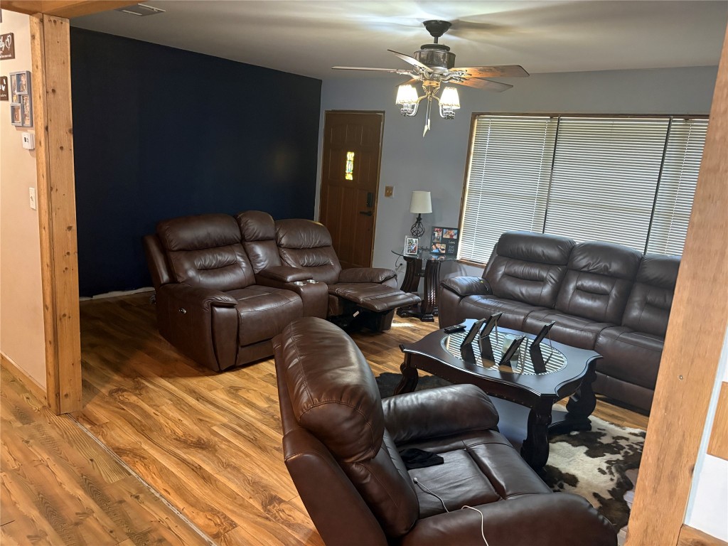 2291 State Highway 71 Columbus, TX 78934 - Photo 4 of 12 a living room with furniture and a chandelier