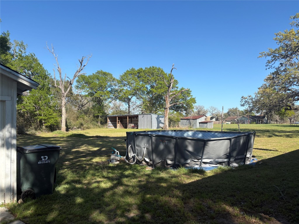 2291 State Highway 71 Columbus, TX 78934 - Photo 7 of 12 a view of a swimming pool with lounge chair