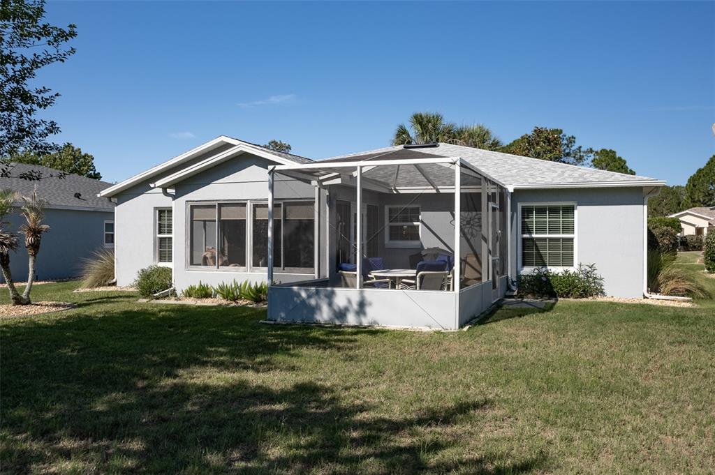 15143 Southwest 14th Avenue Road Ocala, FL 34473 - Photo 40 of 53 a front view of a house with a yard