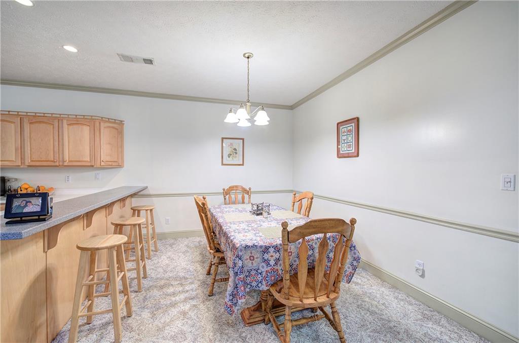 265 Evans Drive Buchanan, GA 30113 - Photo 13 of 123 a view of a dining room with furniture and chandelier