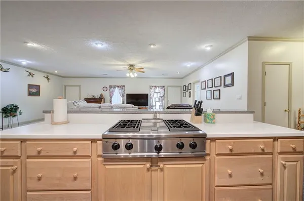 a view of a hallway with closet and wooden floor