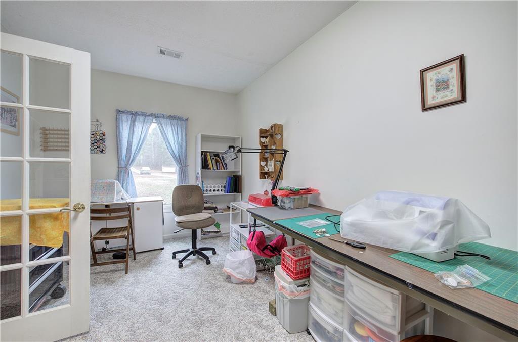 265 Evans Drive Buchanan, GA 30113 - Photo 25 of 123 a view of a workspace with furniture and a window
