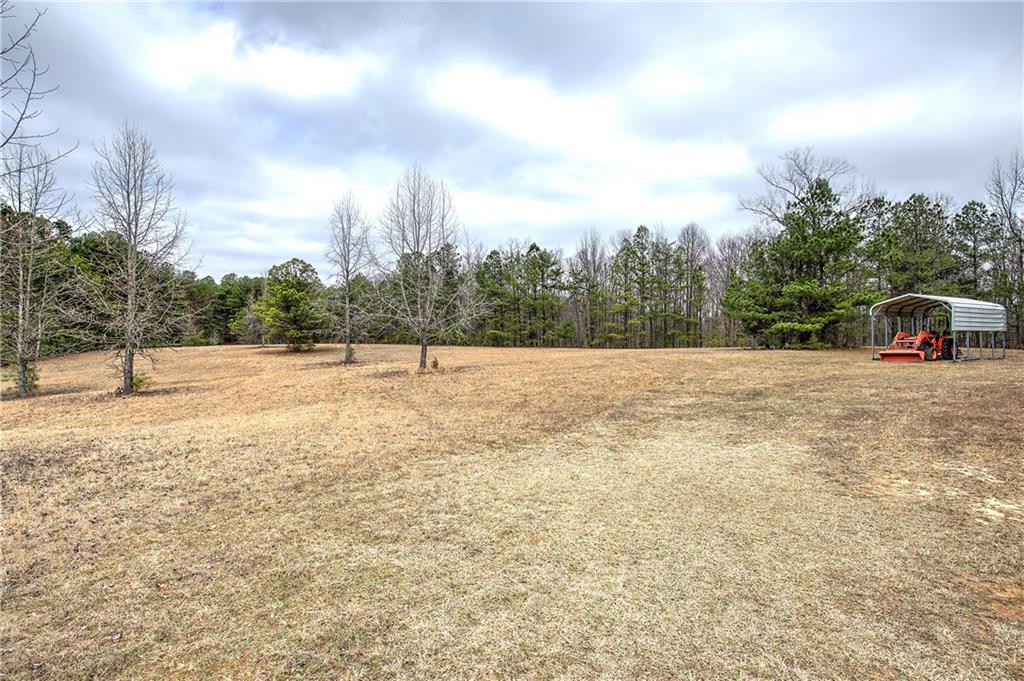 265 Evans Drive Buchanan, GA 30113 - Photo 47 of 123 a view of a field with trees in the background
