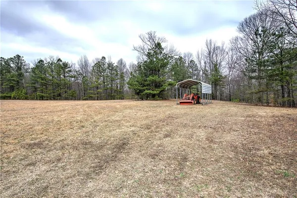 a backyard of a house with lots of trees