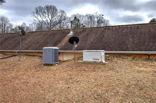 a view of a table and chairs in the garden