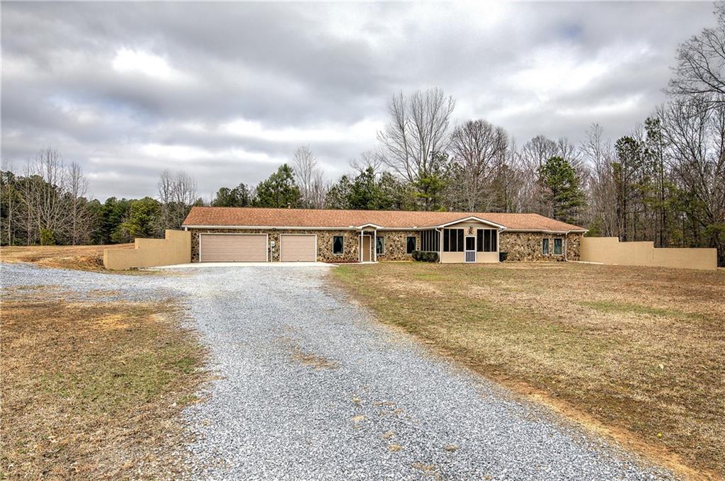 265 Evans Drive Buchanan, GA 30113 - Photo 51 of 123 a front view of house with yard and car parked