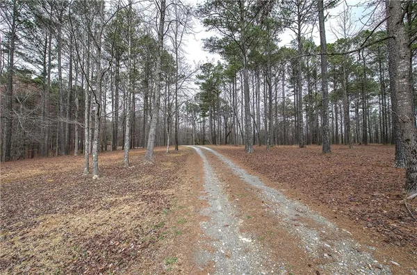 a living room with furniture kitchen and a table