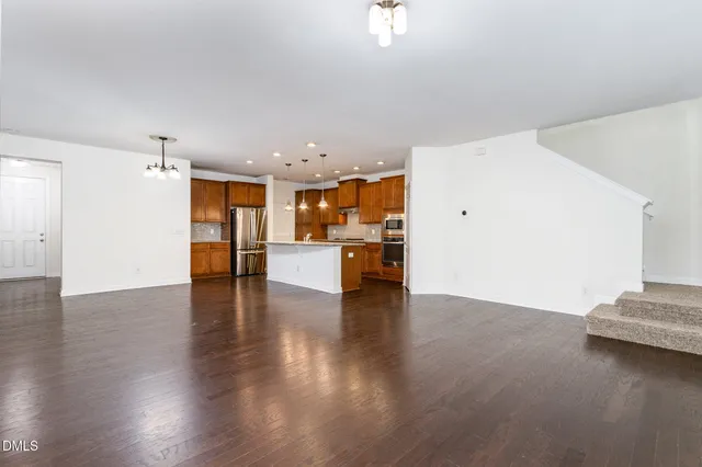 a view of kitchen with furniture and wooden floor