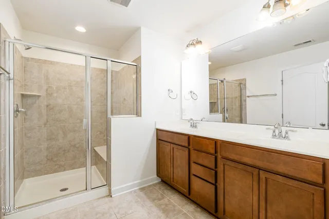 a bathroom with a double vanity sink mirror and double