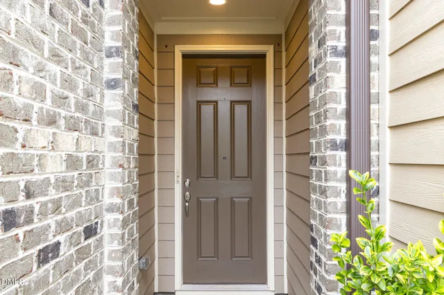 a front view of a house with a entryway