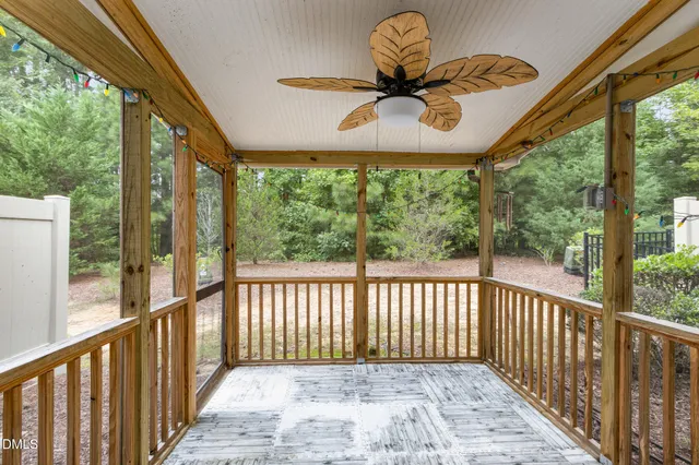 a view of a porch with wooden floor