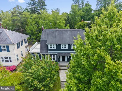 an aerial view of a house with a yard and garden
