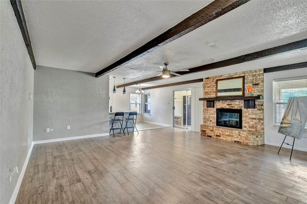 4405 Ray White Road Fort Worth, TX 76244 - Photo 12 of 36 Wood burning fireplace in den