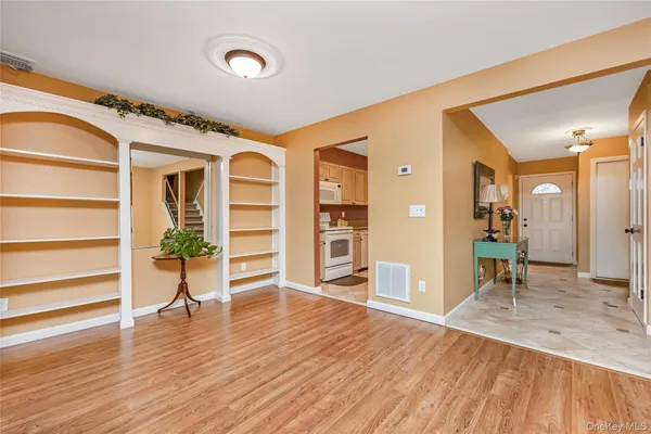 a view of a livingroom with furniture and wooden floor
