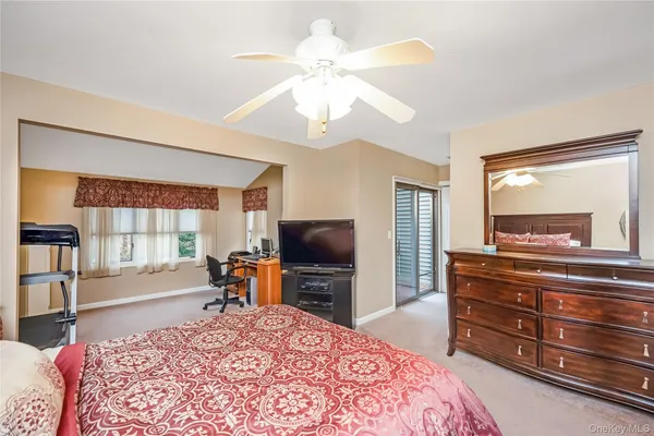 a bed room with a bed and a television