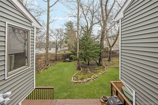 a view of a backyard with sitting area
