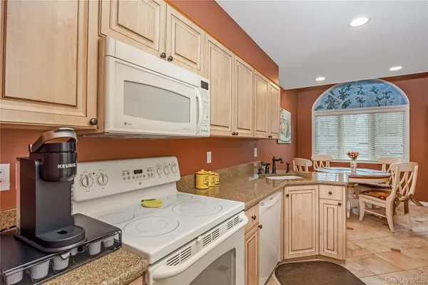 a kitchen with a stove and a cabinets