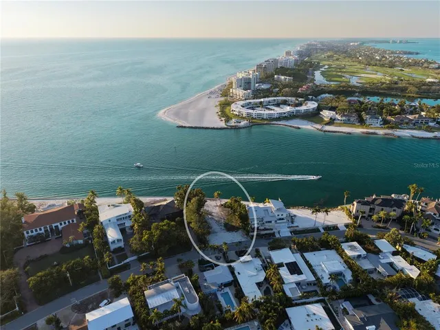 an aerial view of a house with a ocean view