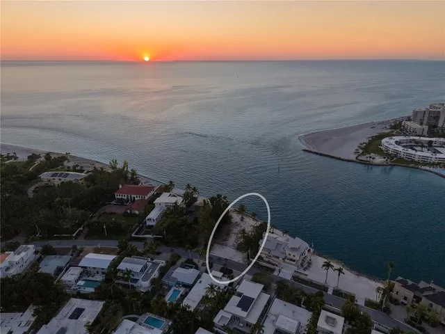 an aerial view of a residential houses with outdoor space