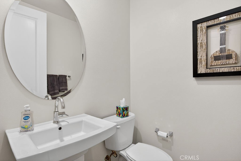 985 Doheny Way Dana Point, CA 92629 - Photo 11 of 21 a bathroom with a toilet sink and mirror