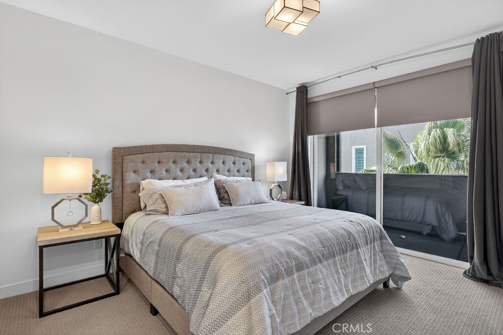 985 Doheny Way Dana Point, CA 92629 - Photo 14 of 21 a bedroom with a bed and a table
