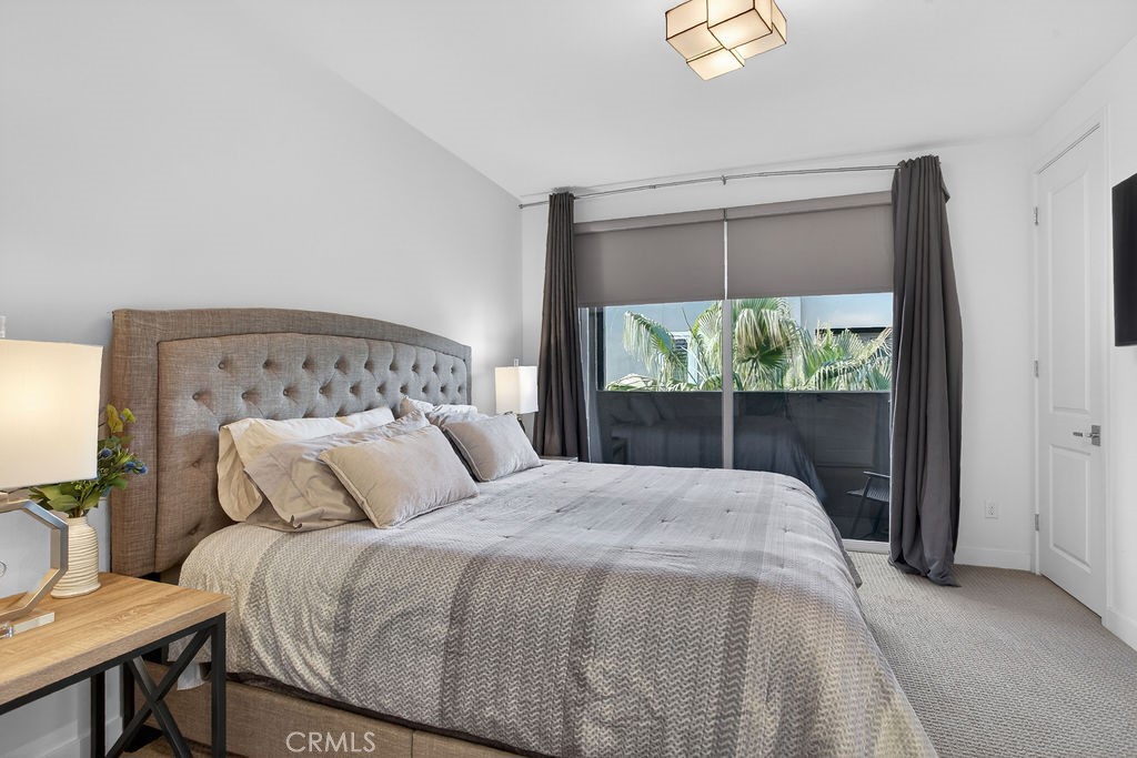 985 Doheny Way Dana Point, CA 92629 - Photo 16 of 21 a bedroom with a large bed and a window