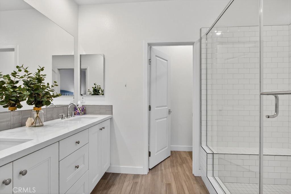 985 Doheny Way Dana Point, CA 92629 - Photo 17 of 21 a bathroom with a granite countertop sink mirror and vanity