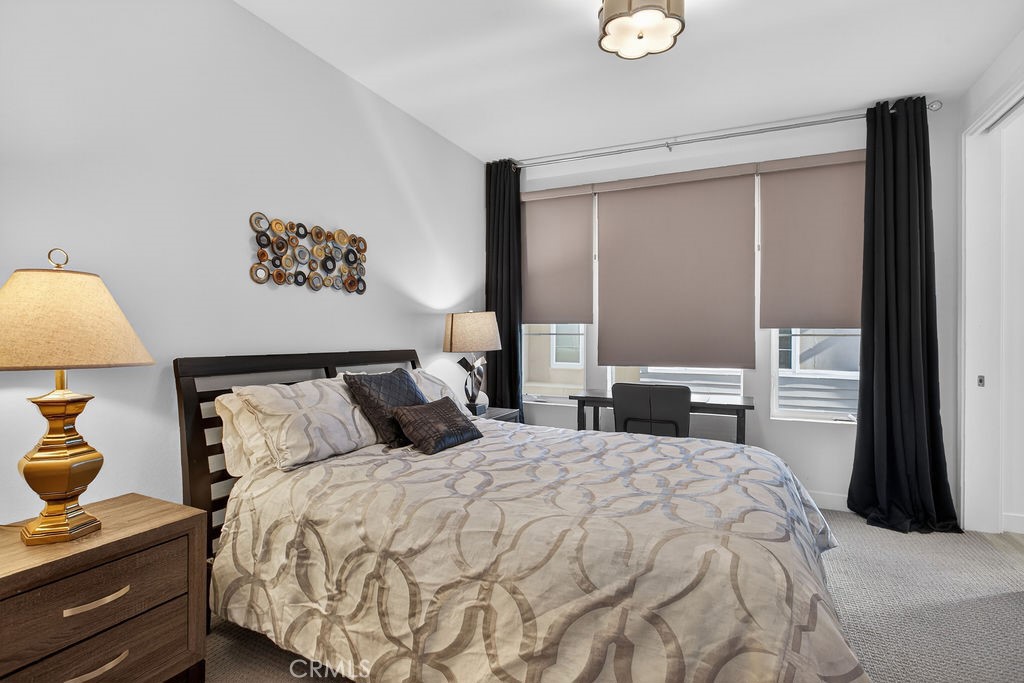 985 Doheny Way Dana Point, CA 92629 - Photo 19 of 21 a bedroom with a bed and a lamp on dresser