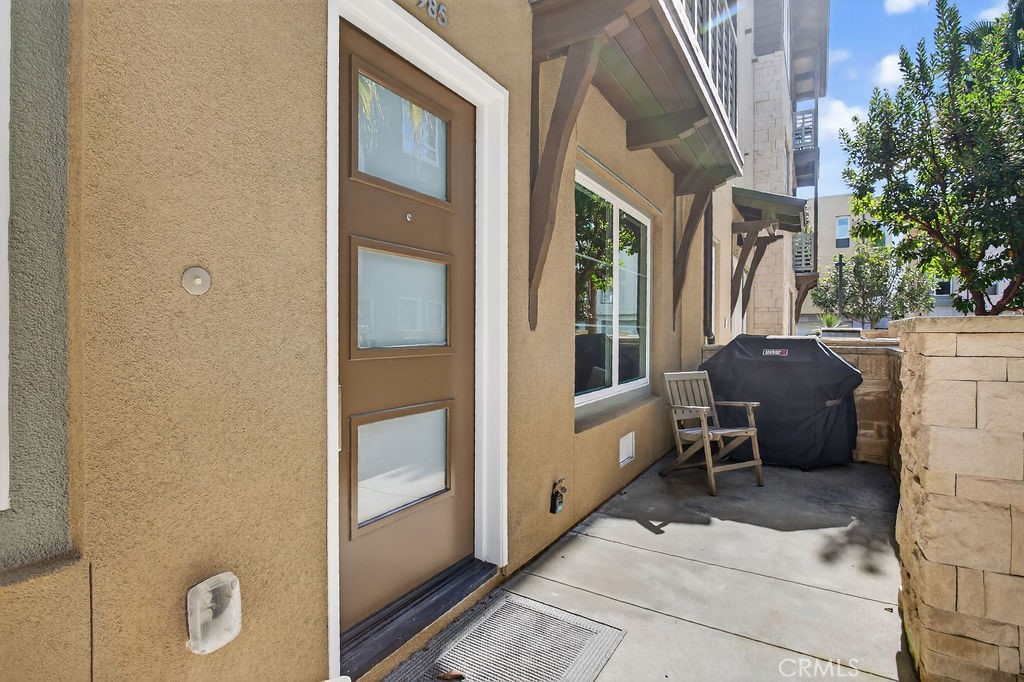 985 Doheny Way Dana Point, CA 92629 - Photo 2 of 21 a balcony with furniture and a potted plant