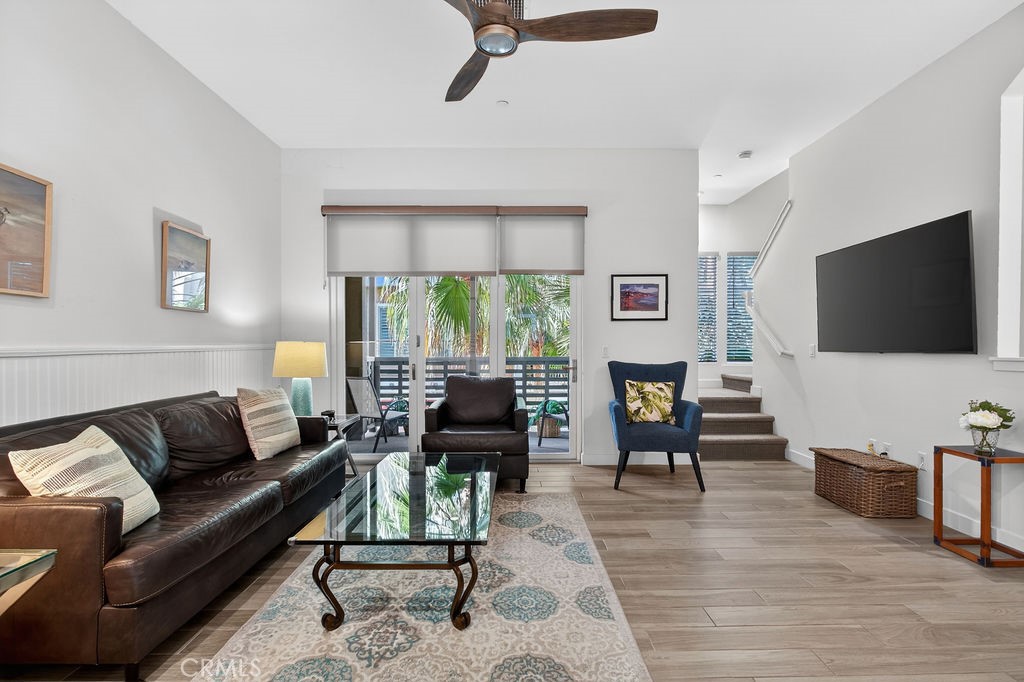 985 Doheny Way Dana Point, CA 92629 - Photo 5 of 21 a living room with furniture and a flat screen tv