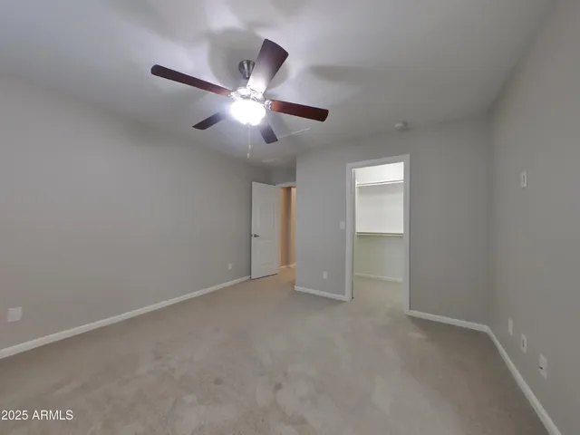 a view of kitchen with stainless steel appliances granite countertop a refrigerator a stove a sink and a microwave