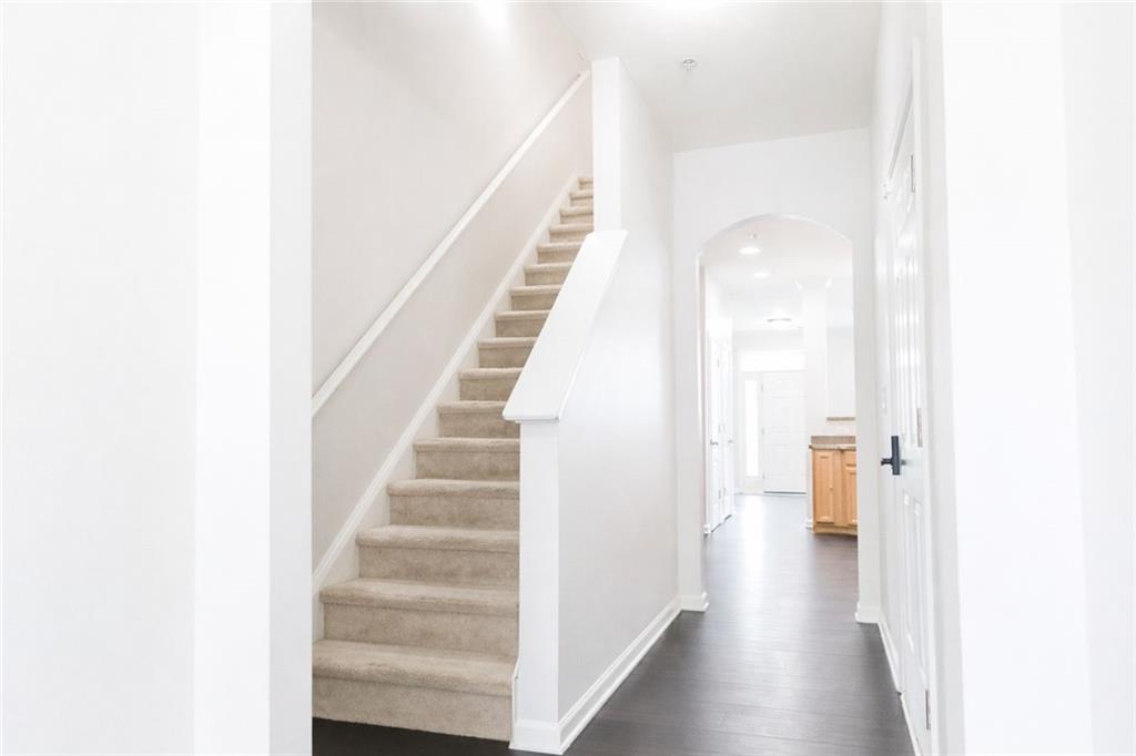 544 Ridge View Crossing Woodstock, GA 30188 - Photo 12 of 30 a view of a hallway with stairs