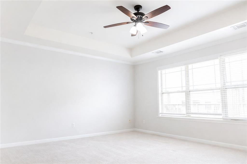 544 Ridge View Crossing Woodstock, GA 30188 - Photo 16 of 30 an empty room with a window and a fan