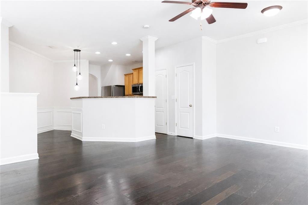 544 Ridge View Crossing Woodstock, GA 30188 - Photo 6 of 30 a view of a kitchen with a sink and a refrigerator