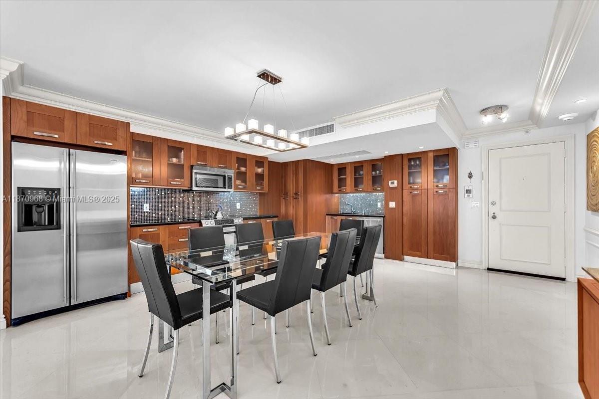 9801 Collins Avenue, Unit 4Y Bal Harbour, FL 33154 - Photo 12 of 71 a view of a dining room with furniture